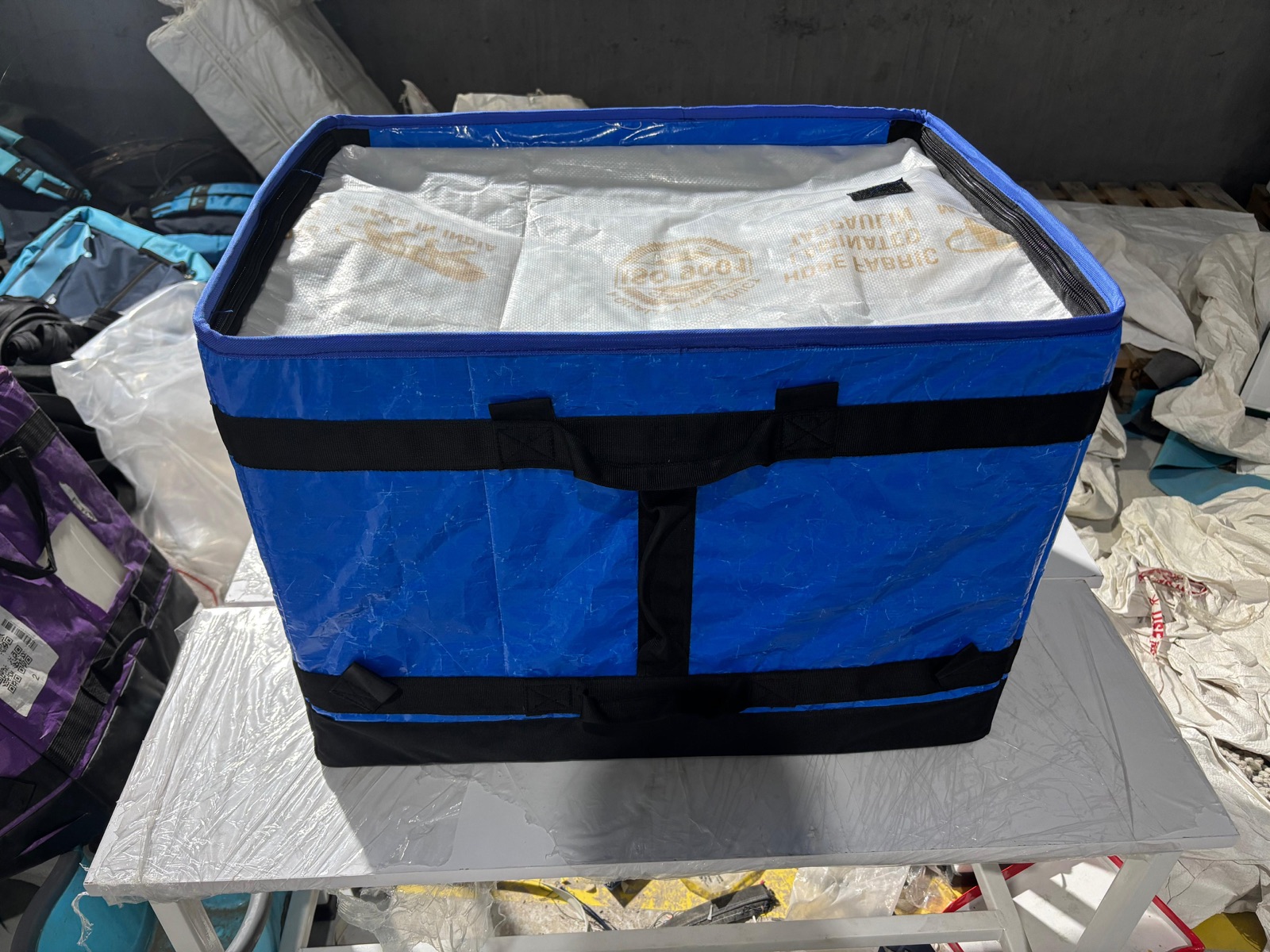 Carrier packed with laminated HDPE fabric goods